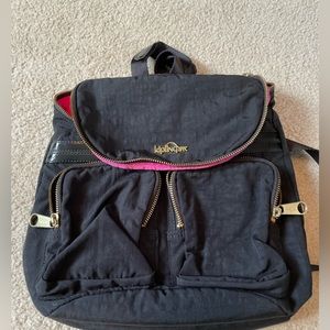 Kipling Backpack in good condition Black with hot pink interior